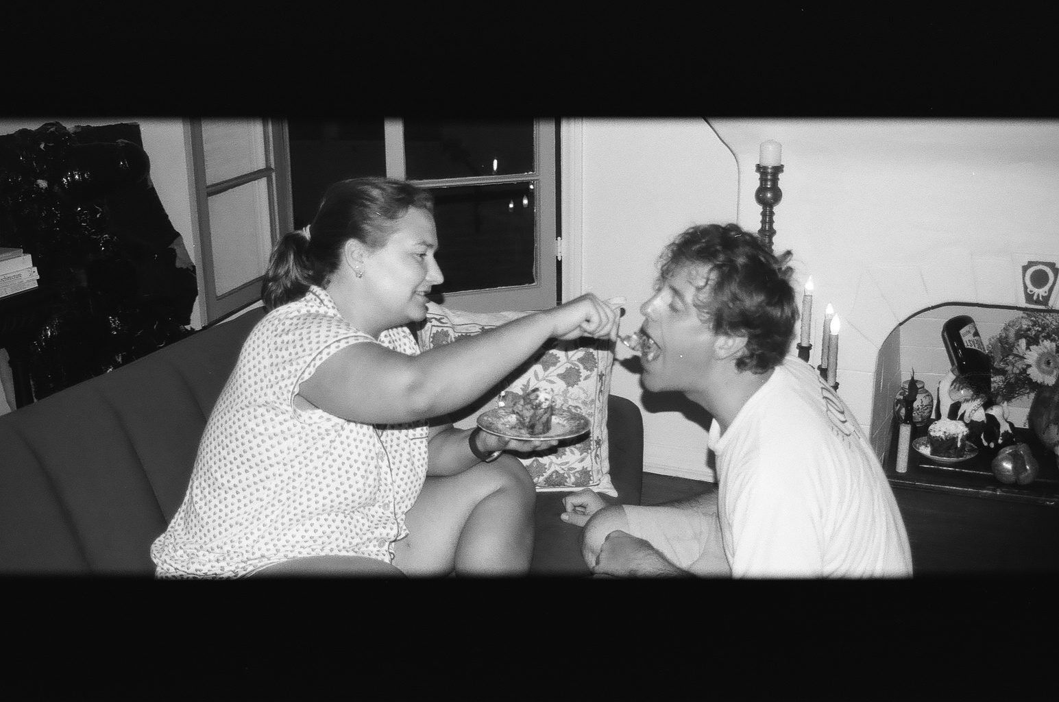 charlotte feeding ryan bread pudding, bw