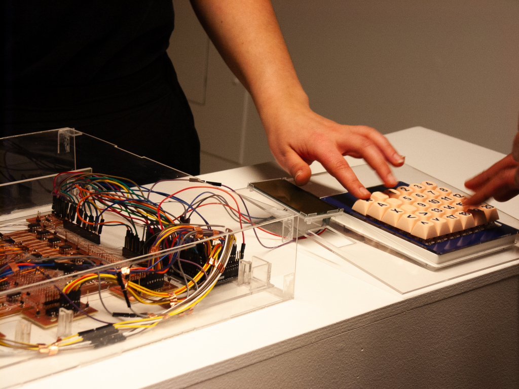 close up of two hands interacting with the memory dialer