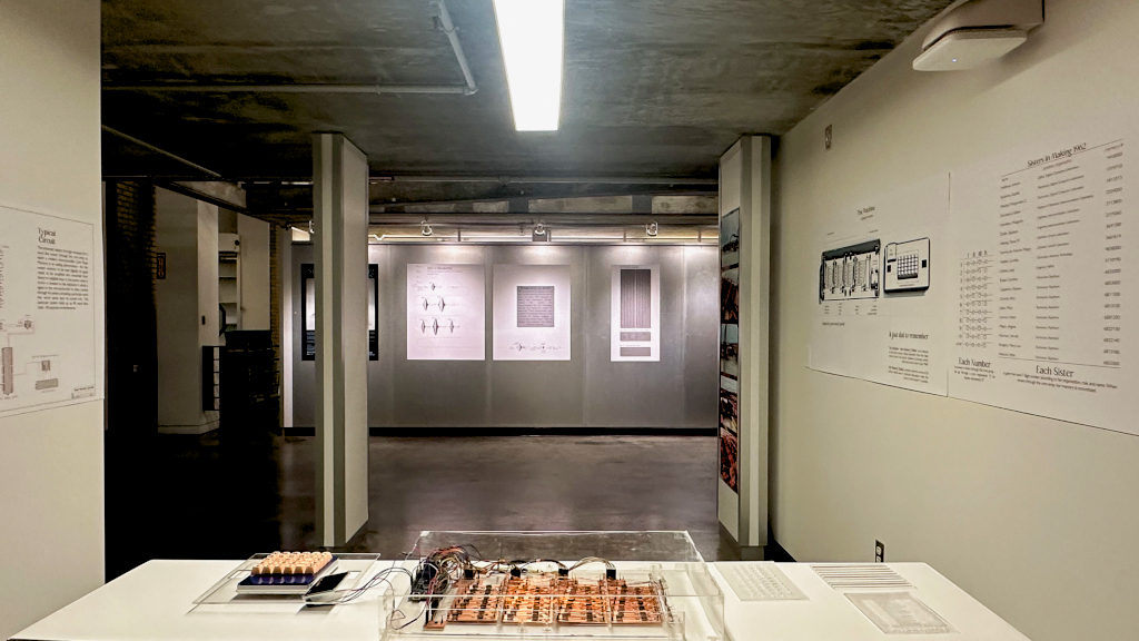 shot of exhibition space with machine and posters