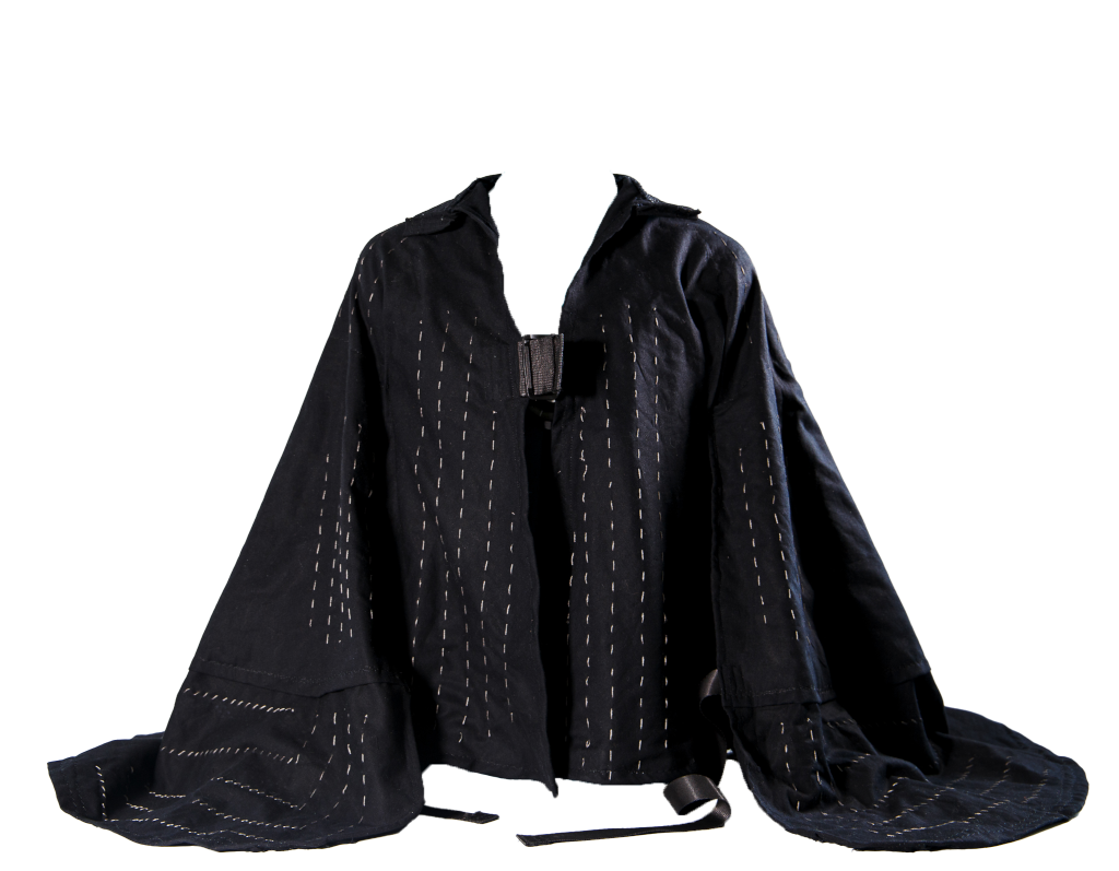 front shot of black flowy jacket with gray embroidery